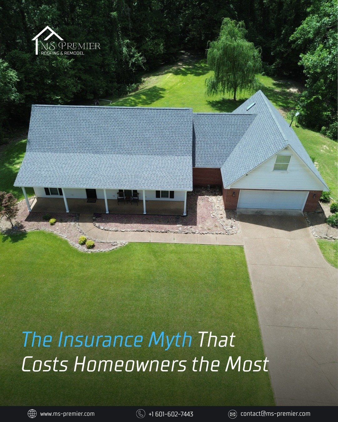 Aerial view of a two-story suburban home with gray roof, white exterior, attached garage, and manicured lawn surrounded by trees